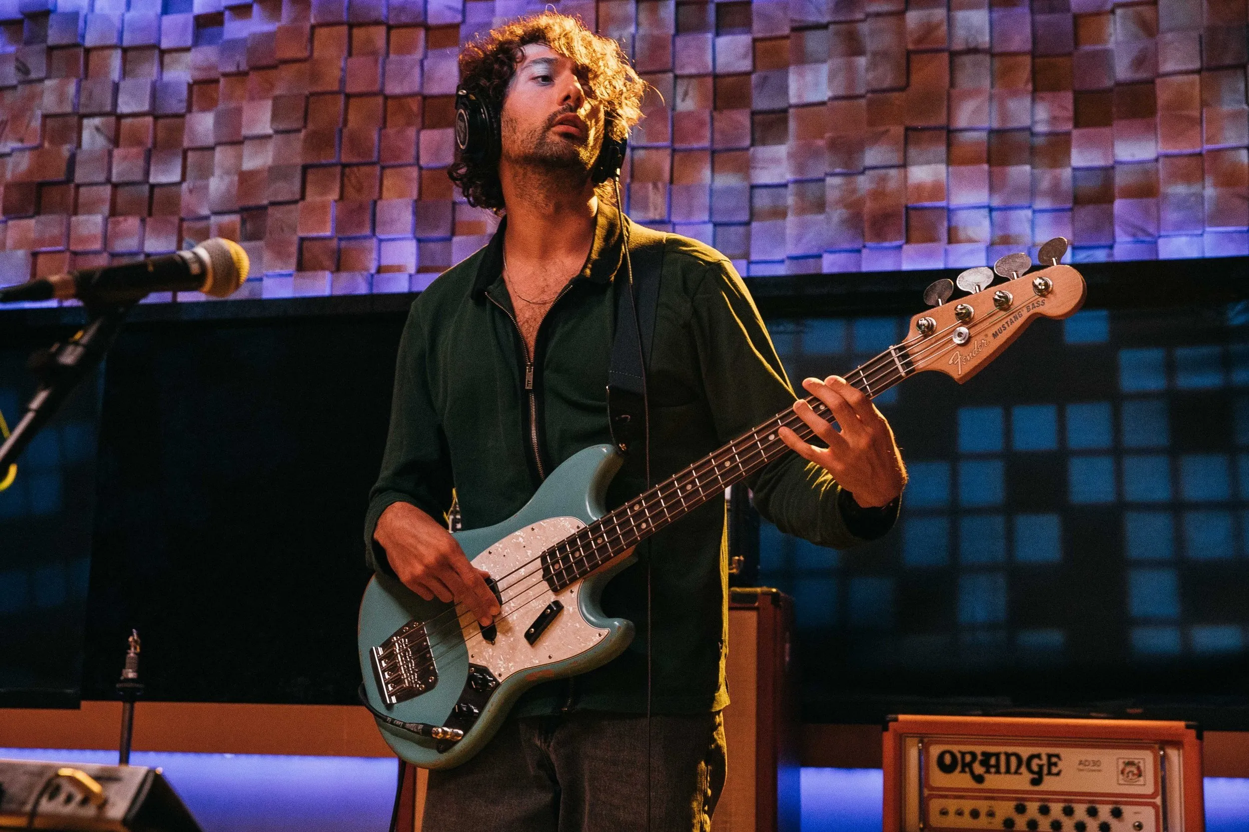 Rami tracking bass in the studio on a Fender Mustang bass